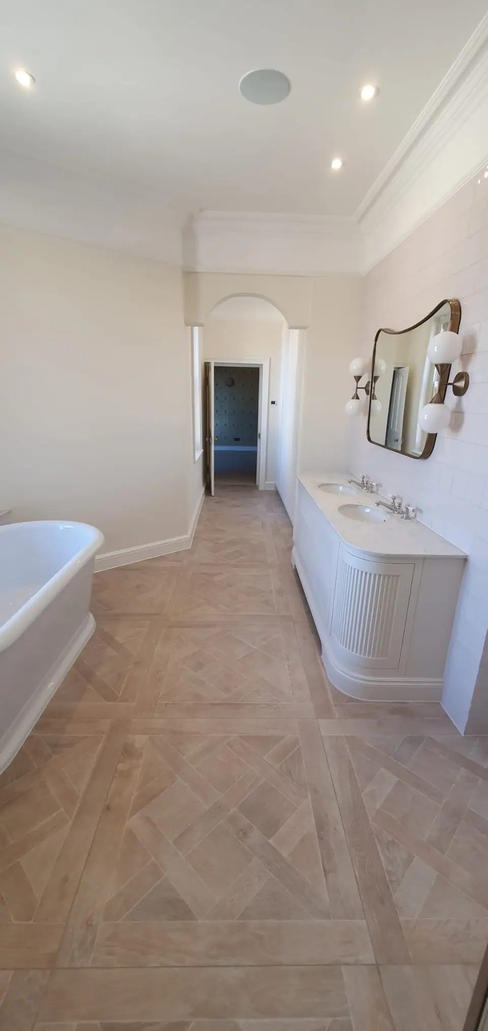 Bathroom with a freestanding bath and twin basins, plumbed by EFW Gas